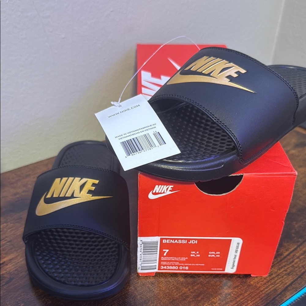 Nike Black Slides with Gold Logo